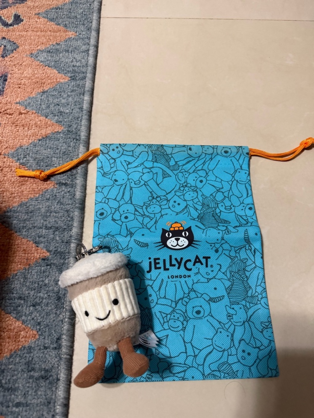 Jellycat Cream and Light Brown Plush Cup Keychain with Blue Bag